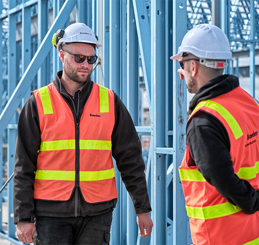 Construction workers showing respect